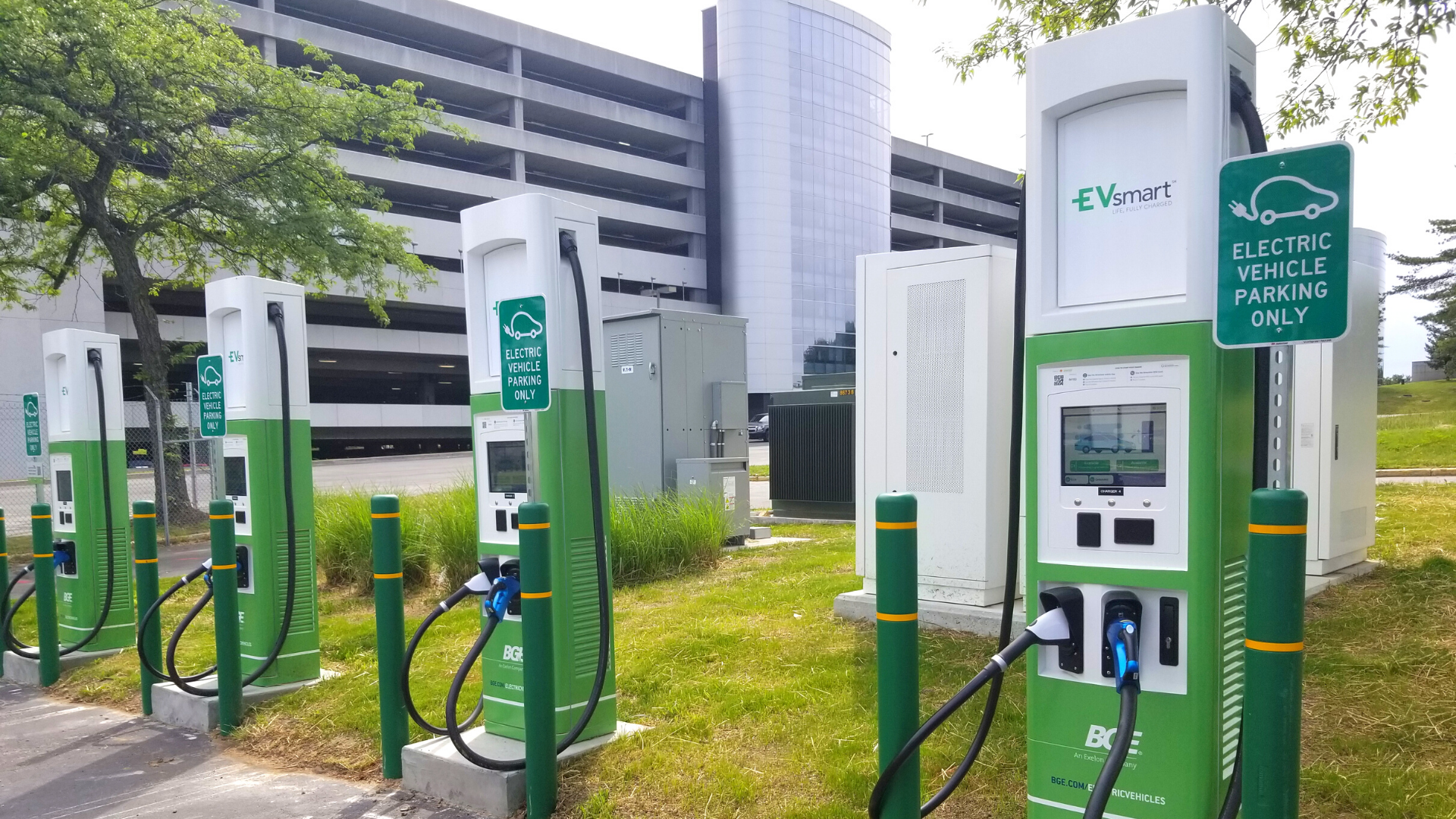 Photograph of row of four new Electric Vehicle charging stations at the BWI Marshall Airport Cell Phone Lot