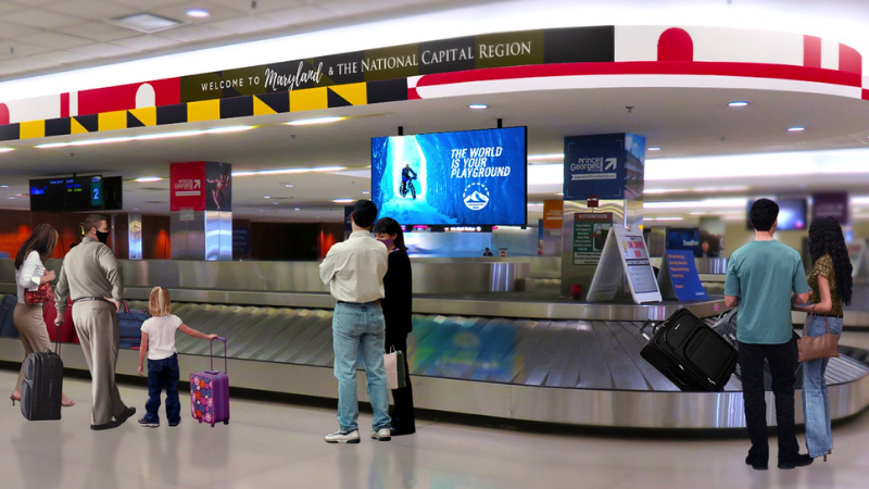 Graphic rendering showing passengers in baggage claim at BWI Marshall Airport with future Clear Channel Airports advertising concepts installed