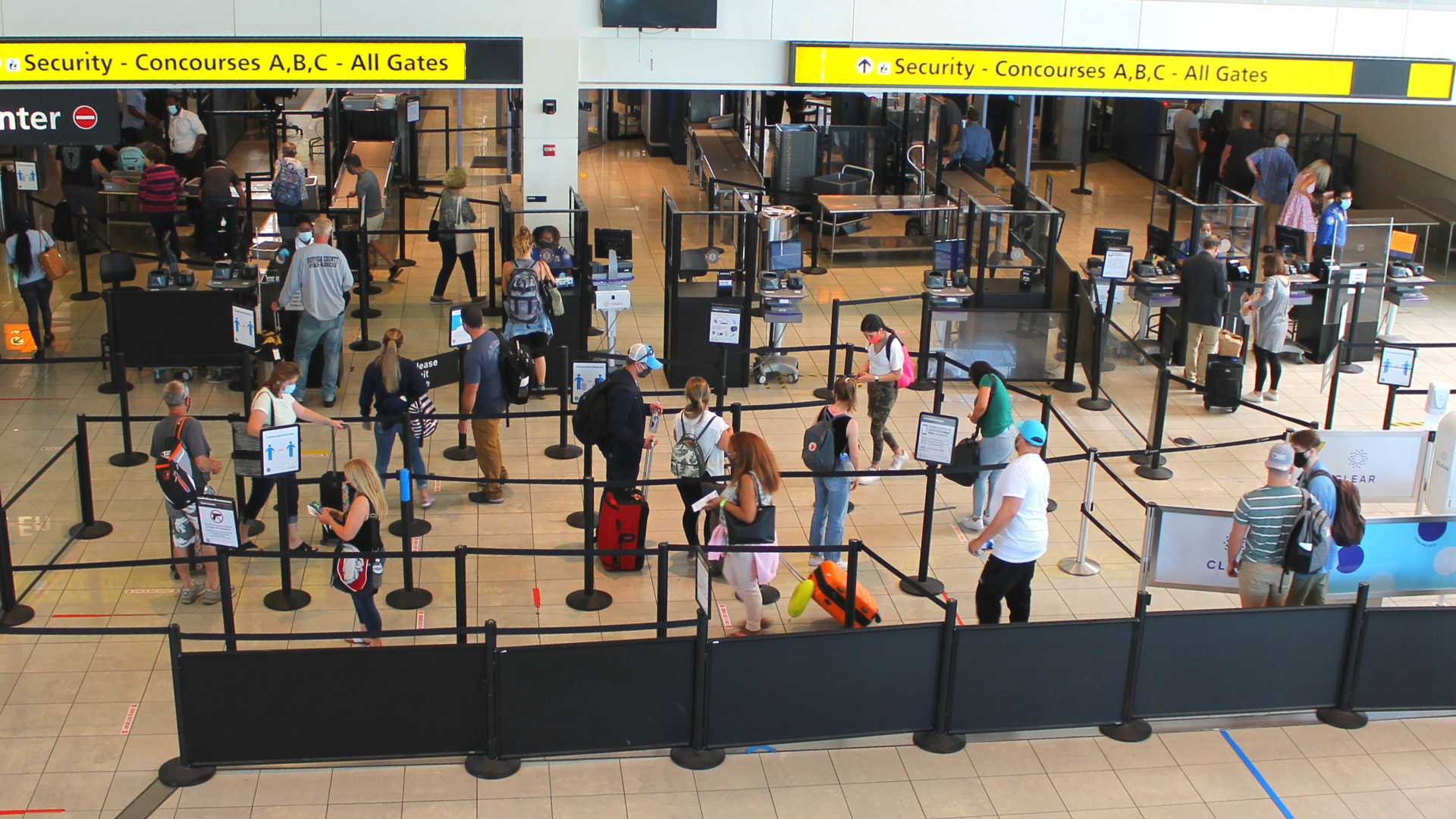 Overhead photograph of masked passengers at Security Checkpoint B at BWI Marshall Airport