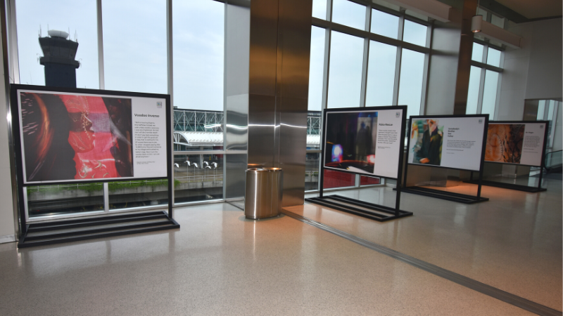 Photograph of a multi-panel human trafficking exhibit within the Hourly Garage at BWI Marshall Airport