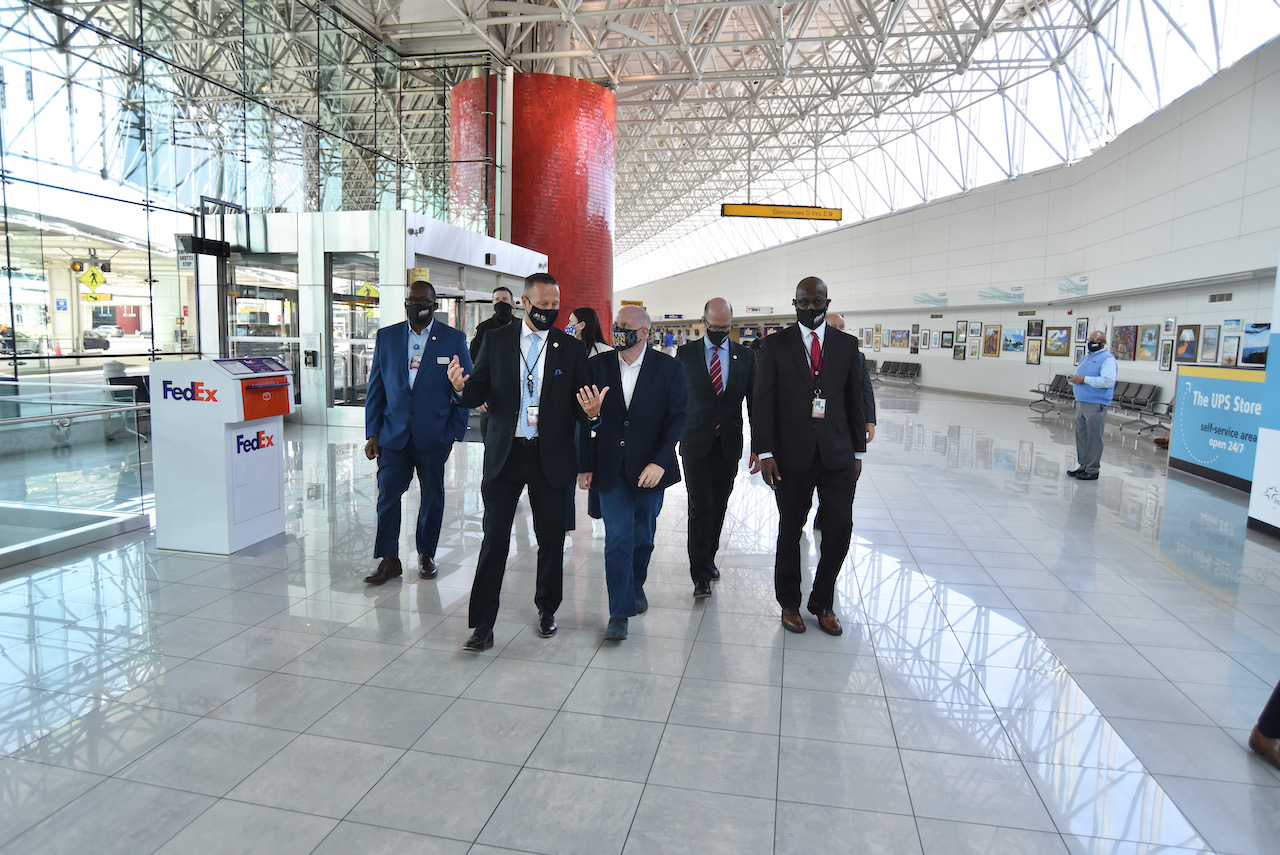 Photograph of Governor Hogan and officials walking through the BWI Marshall Airport terminal