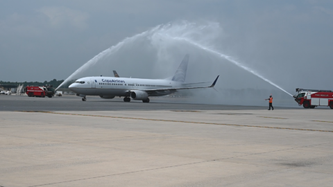 Photo of a Copa Airlines aircraft receiving a water salute as it taxis to its gate at BWI Marshall Airport