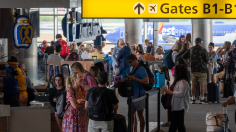 Photo of passengers at the base of the walkway to Concourse B at BWI Marshall Airport.