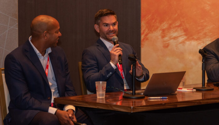 Photo of two panelists, one of them speaking, during a breakout session at the 2024 SynergyBWI Business and Networking Event.