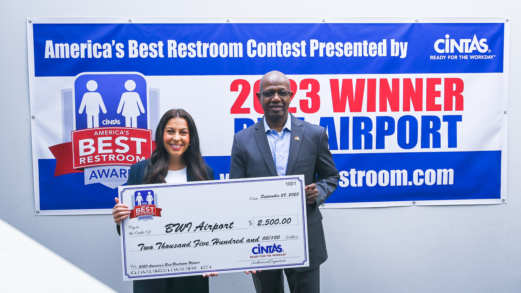 Photo of Cintas and airport representatives during an event recognizing the airport as home of America's Best Restroom, circa 2023.