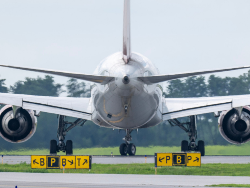 Rear view photo of an aircraft on a taxiway at BWI Thurgood Marshall Airport.