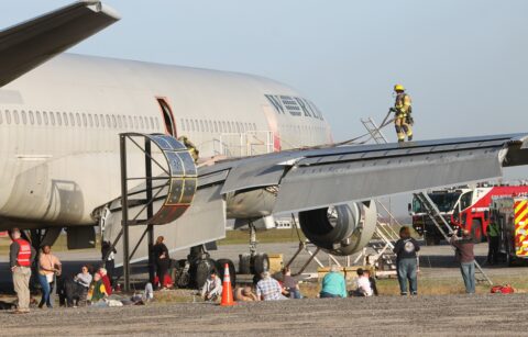 Photo of a decommissioned aircraft with first responders and mock victims during an emergency preparedness exercise at BWI Thurgood Marshall Airport.