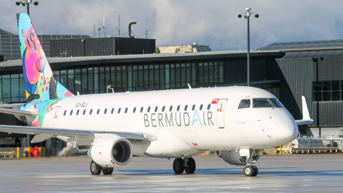 Photo of a BermudAir aircraft taxiing towards the airfield at BWI Thurgood Marshall Airport with the airport terminal building in the background.