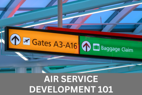Photo of overhead wayfinding sign inside BWI Thurgood Marshall Airport with white text in a grey box along the bottom of the image that reads Air Service Development 101